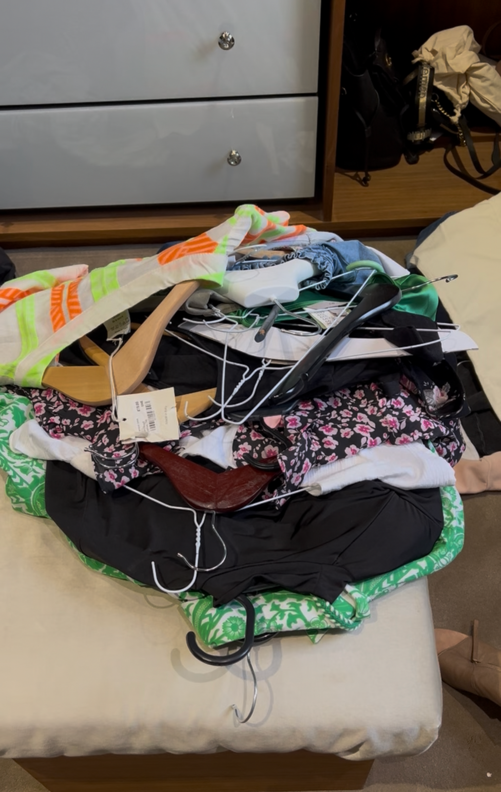 Clothes pulled out for wardrobe decluttering and organisation