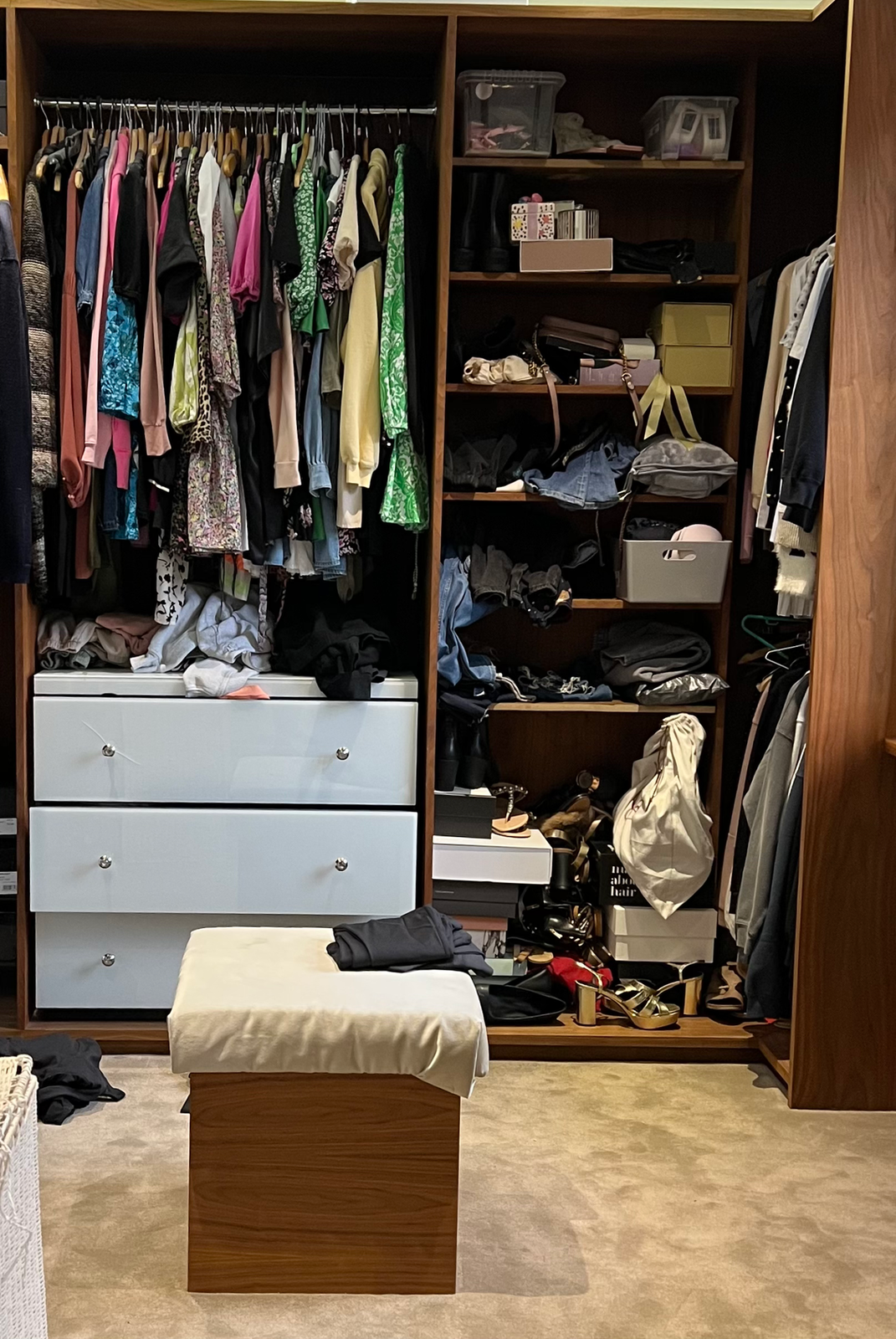 Clothes stored across two bedrooms before wardrobe organisation in Berkhamsted