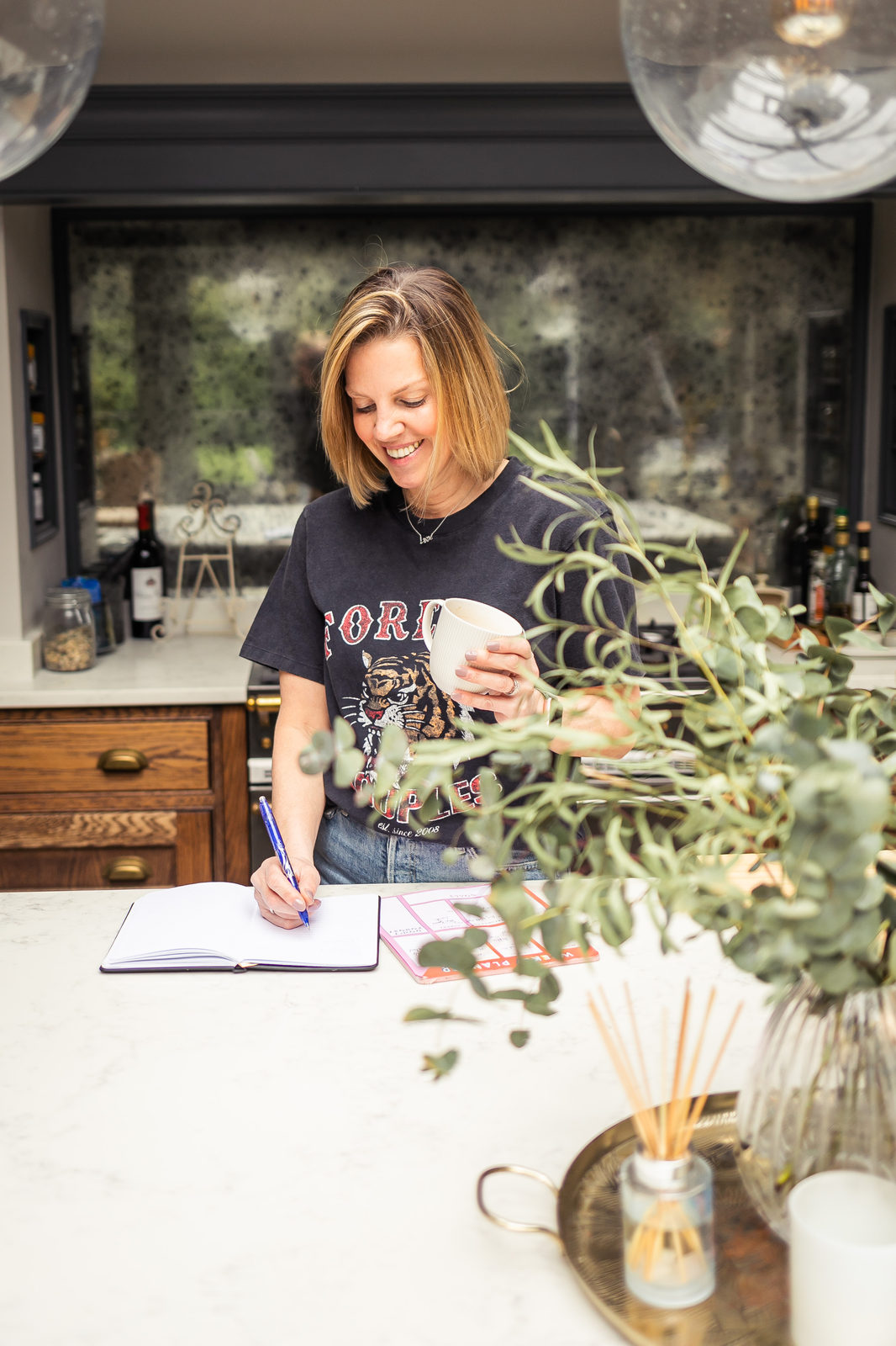 Helen Dear, professional home organiser, photogrphed in a kitchen 